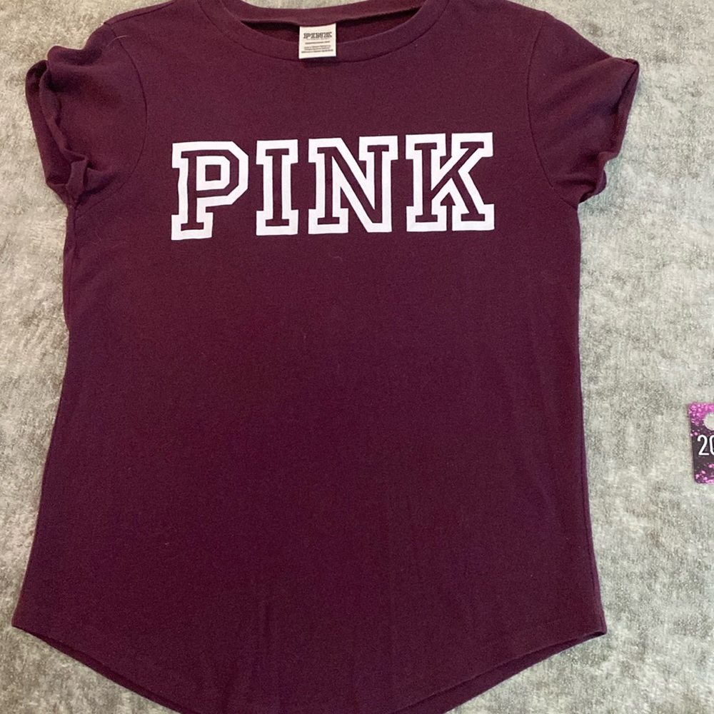 Pink Victoria’s Secret size XS burgundy with white lettering. {202}